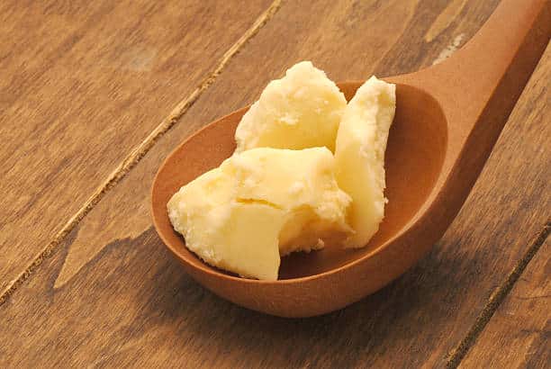 Raw African Shea Butter in a brown African local serving spoon.