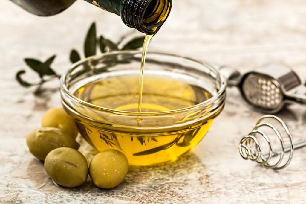 Olive Oil squeezed  from the Olive Fruit in a bowl. 