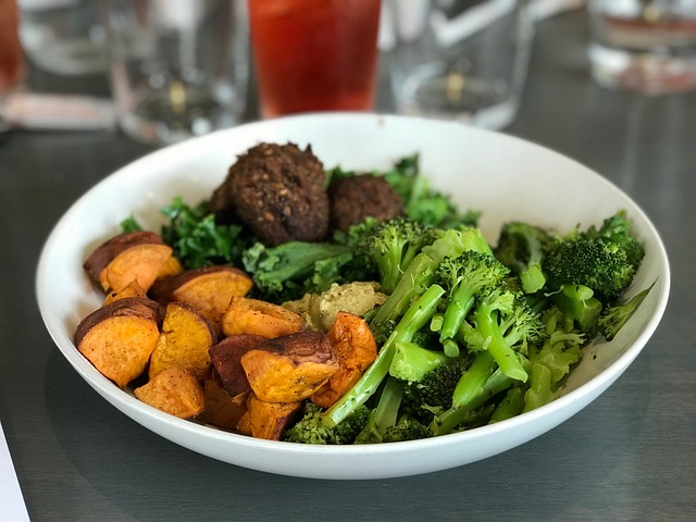 A healthy sweet potato meal which includes sweet potatoes, Broccolis and meat balls.