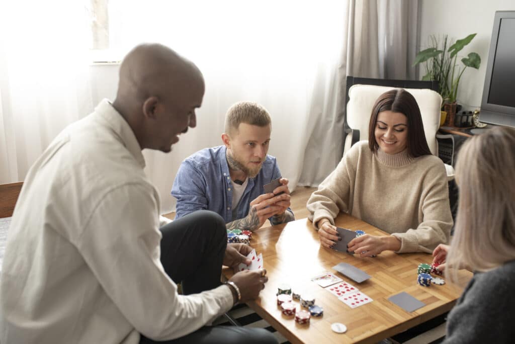 Four Friends having fun while playing poker.