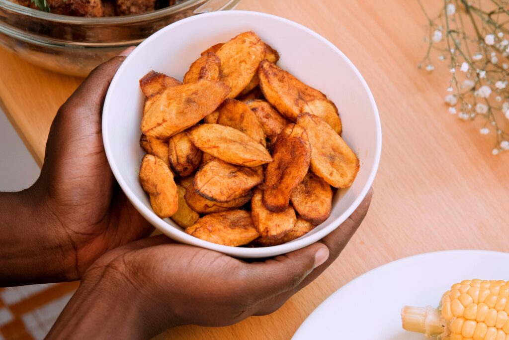 Freshly fried plantain in a white plate.